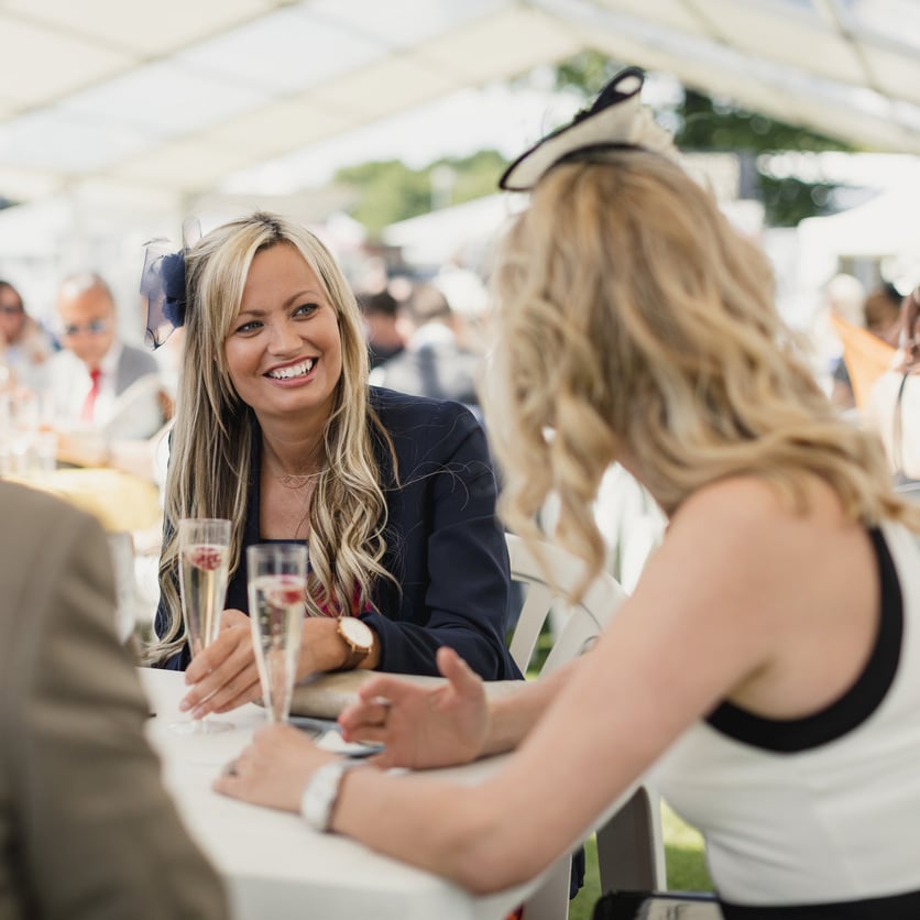 Button featuring photo of 2 females enjoying a corporate event at Arcadia at Edgewood