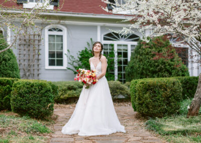 Gallery Image of bride behind manor house