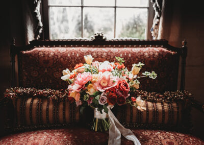 Gallery Image of bouquet on bridal suite couch